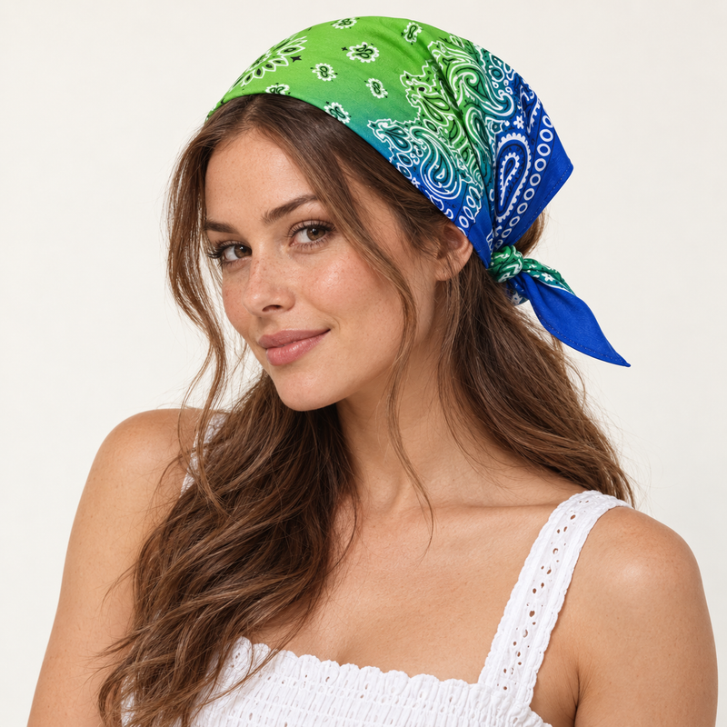 Model wearing a green and blue paisley bandana as a head scarf tied behind her head.