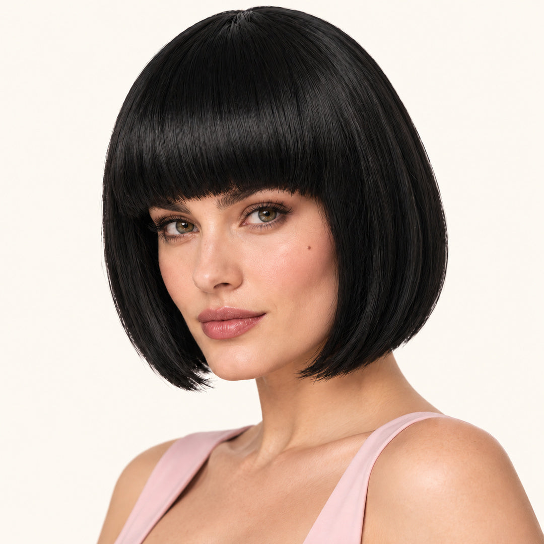 Model wearing a black straight bob wig with full fringe.