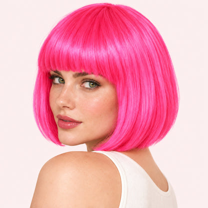 Model wearing a hot pink straight bob wig with full fringe.