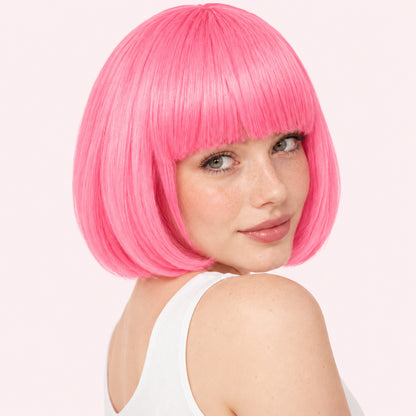 Model wearing a pink straight bob wig with full fringe.