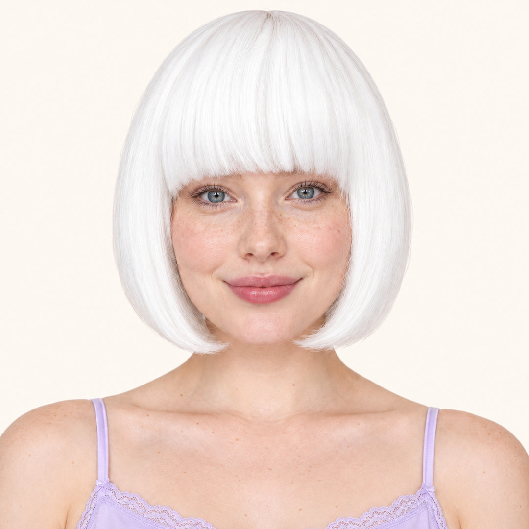 Model wearing a white straight bob wig with full fringe.