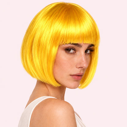 Model wearing a yellow straight bob wig with full fringe.